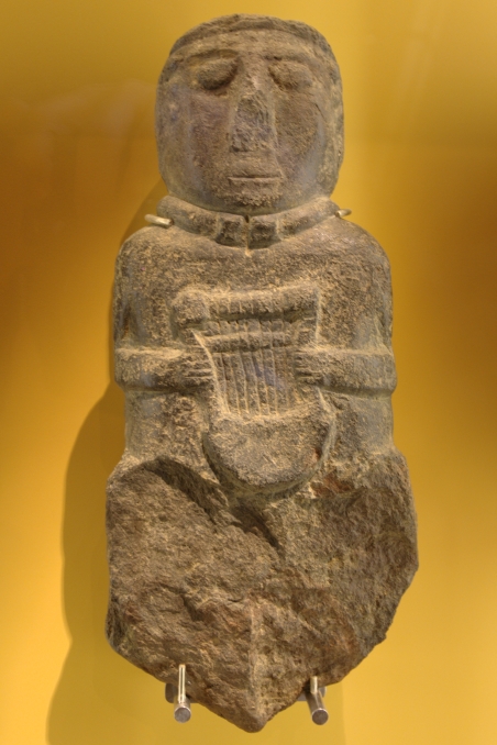 ancient Gallo-Celtic statue with an ancient Celtic crwth (lyre)